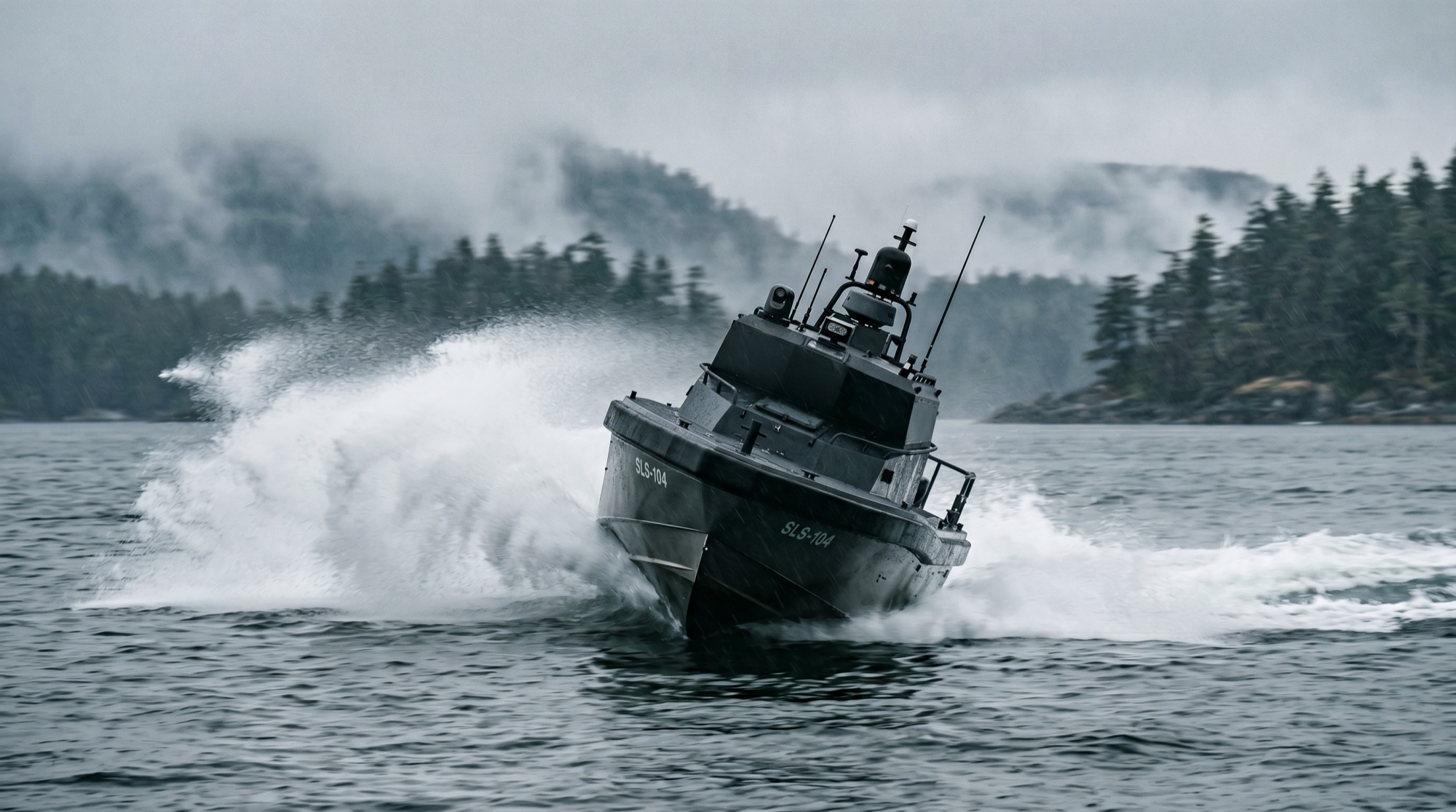Riptide interceptor USV at speed on dark coastal water
